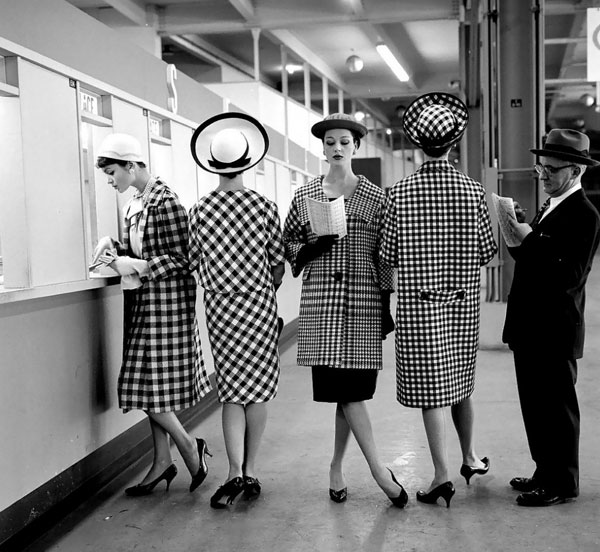 Women at Roosevelt Raceways in checkered coats by Nina Leen.
