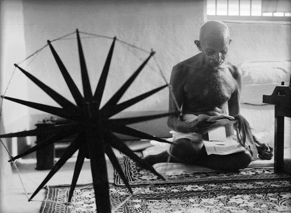 Mahatma Ghandi and his spinning wheel by Margaret Bourke-White.