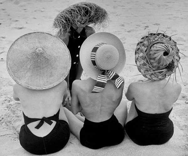 Women wearing beach hats by Nina Leen.