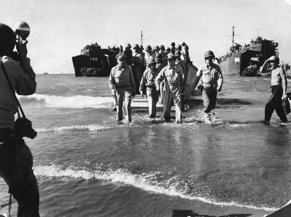 General MacArthur wades ashore at Lingayen Gulf. Photo by Carl Mydans.