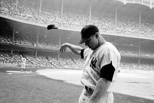 Mickey Mantle tosses helmet by John Dominis