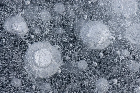 Bubbles trapped in thick lake ice, Greenwood Lake, New York, 2014.