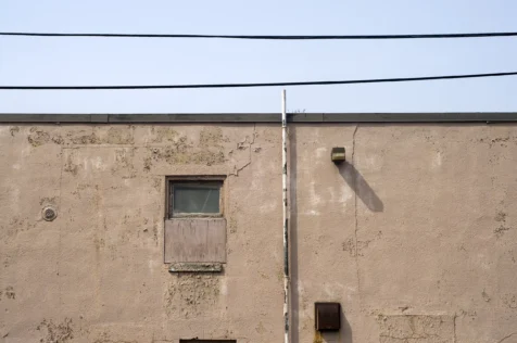 A building and power lines on a sunny afternoon in Nyack, New York, 2014.