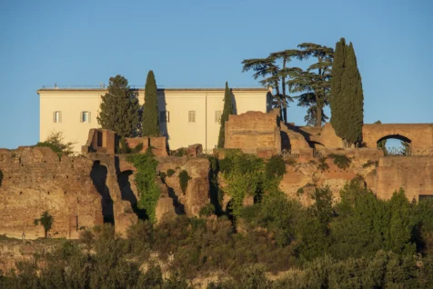 A building and trees on Palatine Hill on a sunny day in Rome, Italy, 2022.