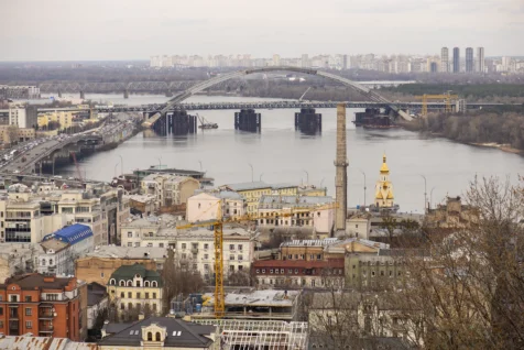 Assorted buildings and a bridge over the Dniepr River in Kyiv, Ukraine, 2020.