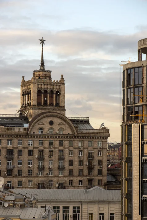 An Old Soviet building and modern one under construction in Kyiv, Ukraine, 2019.