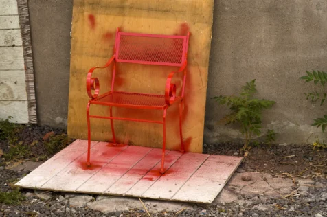 A freshly-painted red chair in Nyack, New York, 2015.