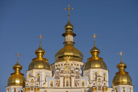 The golden domes of St. Michael's Monastery on a sunny day in Kyiv, Ukraine, 2019.