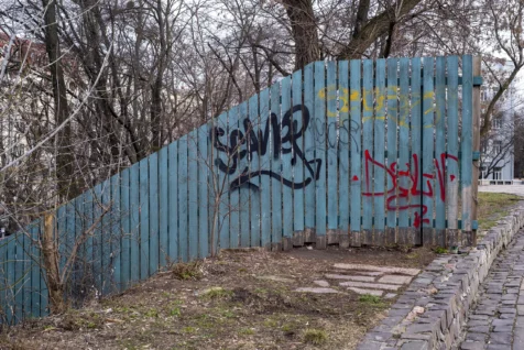 Colorful graffiti on a wooden fence at a park in Kyiv, Ukraine, 2020.
