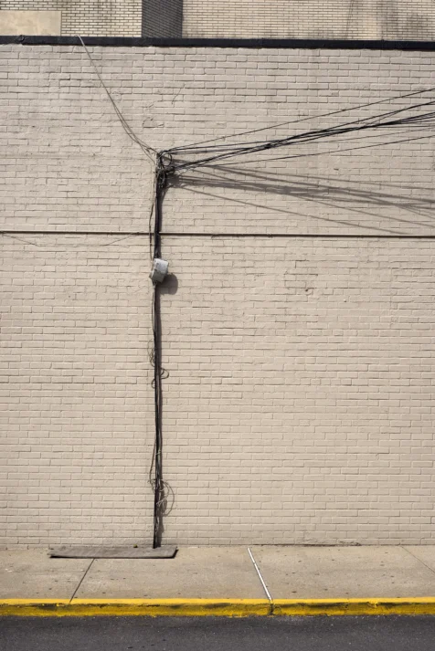 A mess of cables near a building in Palisades Park, New Jersey, 2016.
