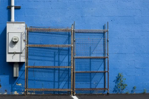 Metal racks and blue brick wall in Tappan, New York, 2015.