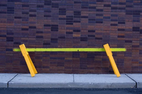A neon barrier and contrasting brick wall in Nyack, New York, 2014.