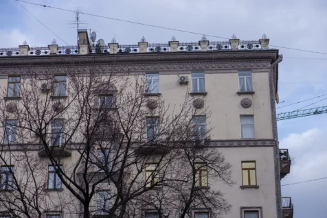 An old building with a fence on the roof on Khreschatyk Street in downtown Kyiv, Ukraine, 2020.