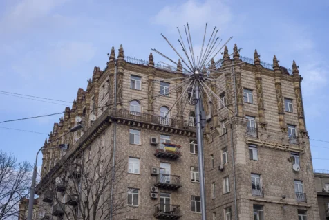An old building with a Ukrainian flag on a balcony on Khreschatyk Street in Kyiv, Ukraine, 2020.