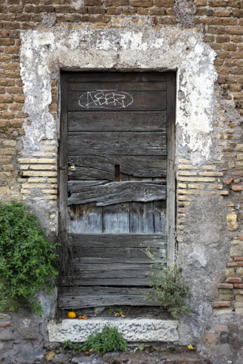An old wooden door at the Giardino degli Aranci in Rome, Italy, 2022.
