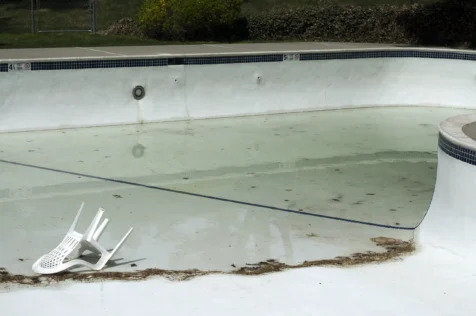 An overturned plastic chair in a swimming pool in Valley Cottage, New York, 2014.