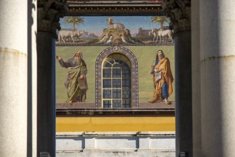 A mural and pillars at the Papal Basilica of St. Paul Outside the Walls in Rome, Italy, 2022.