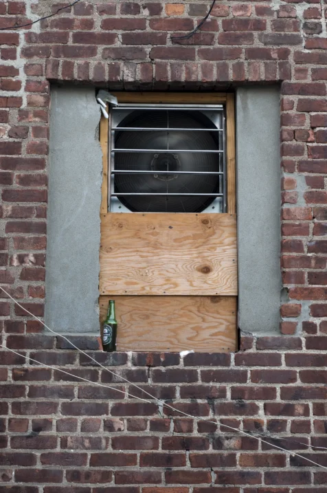 A restaurant fan and bottle of beer in Nyack, New York, 2013.
