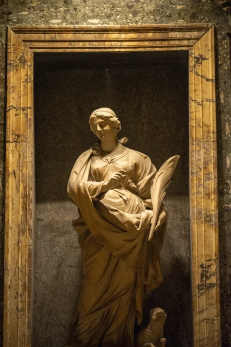 A framed sculpture of a woman at the Pantheon in Rome, Italy, 2022.
