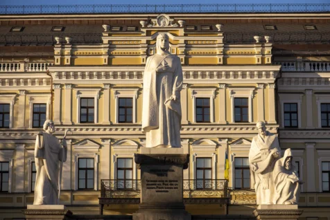 The Princess Olga Monument in front of a yellow building on a sunny day in Kyiv, 2019, Ukraine.