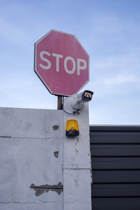 A stop sign and security camera on the grounds of Kyiv Pechersk Lavra, 2019.
