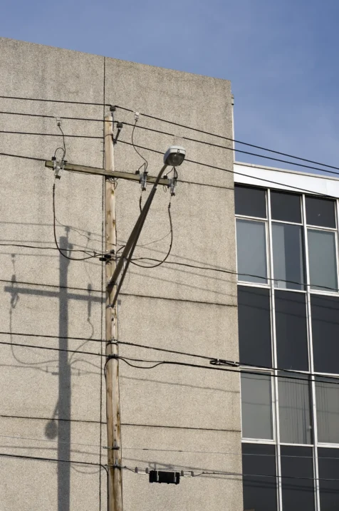 A streetlight and shadows on an office building in New City, York, 2014.