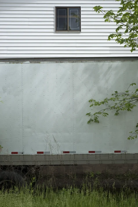 A tractor trailer next to a bulding in Monroe, New York, 2016.