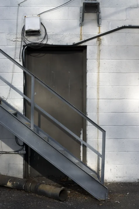 A useless door at the back of a strip mall in New City, New York, 2014.