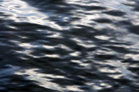 Abstract, metallic reflections in the Hudson River near Nyack, New York, 2015.