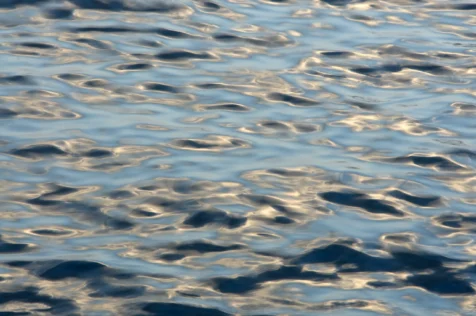 Abstract, shiny reflections in the Hudson River near Nyack, New York, 2015.