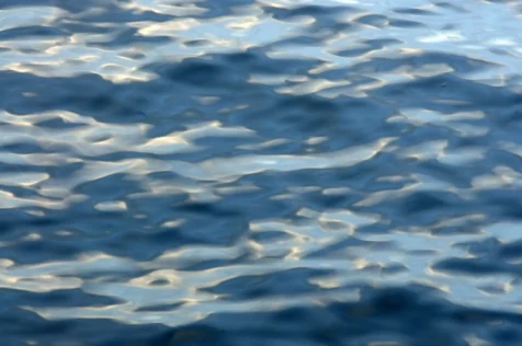 Abstract light blue reflections in the Hudson River near Nyack, New York, 2015.