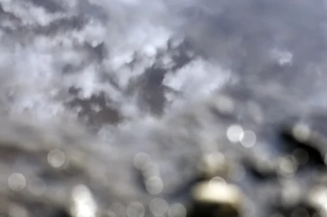 Clouds reflected in water on a sunny day in Nyack, New York, 2013.