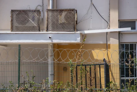 A barbed-wire fence near a building in Antalya, Turkey, 2023.