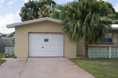 A beware of the dog sign on a garage in Port Saint Lucie, Florida, 2016.