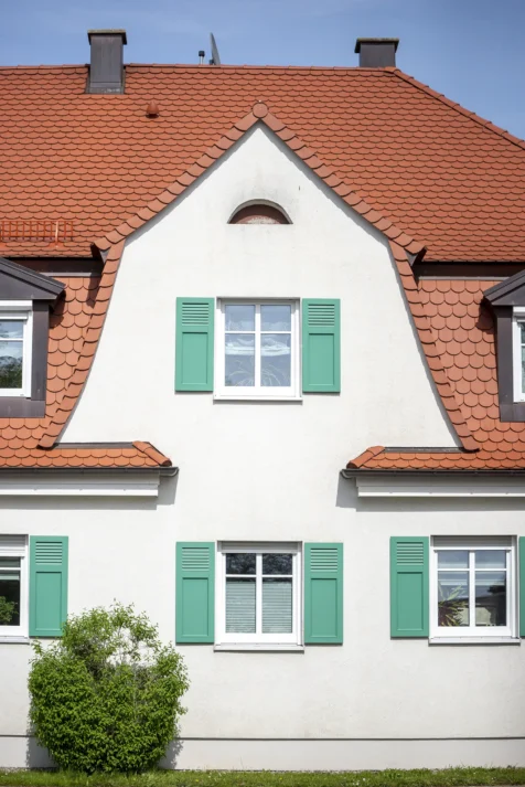 A big white house on a sunny afternoon in Wiblingen, Germany, 2023.