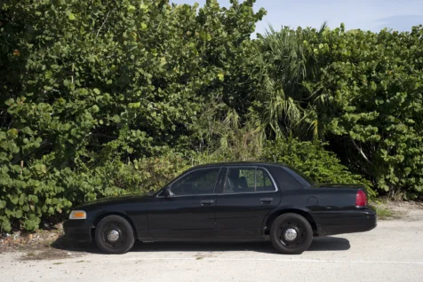 A parked black Ford Crown Victoria in Jensen Beach, Florida, 2016.