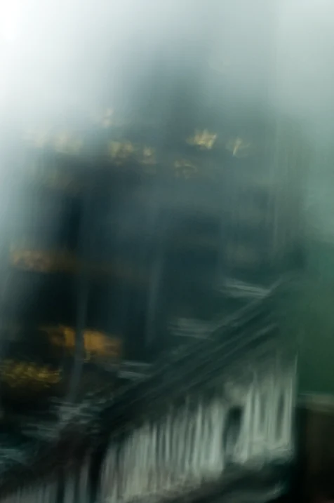 Assorted buildings on 49th Street captured through a windshield on a rainy day in New York City, 2014.