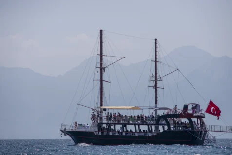 A boat showing tourists the sights in the Mediterranean Sea off the coast of Antalya, Turkey, 2023.