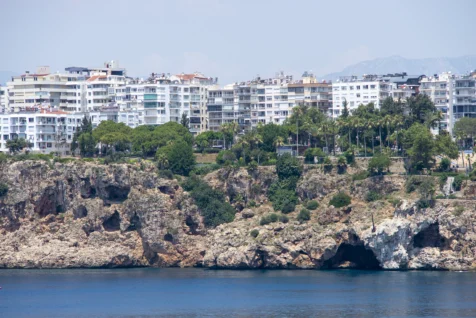 Assorted buildings and cliffs near the Mediterranean Sea in Antalya, Turkey, 2023.