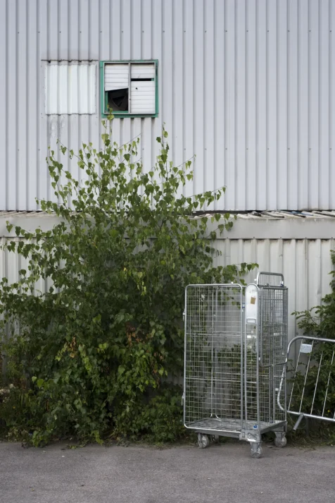 A cart and plant outside a warehouse in Manchester, England, 2017.