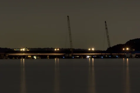 Cranes and lights on the Tappan Zee Bridge at night captured from Nyack, New York, 2015.