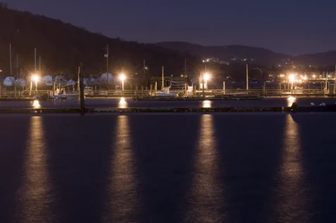Dock lights reflected in the Hudson River at night in Piermont, New York, 2011.