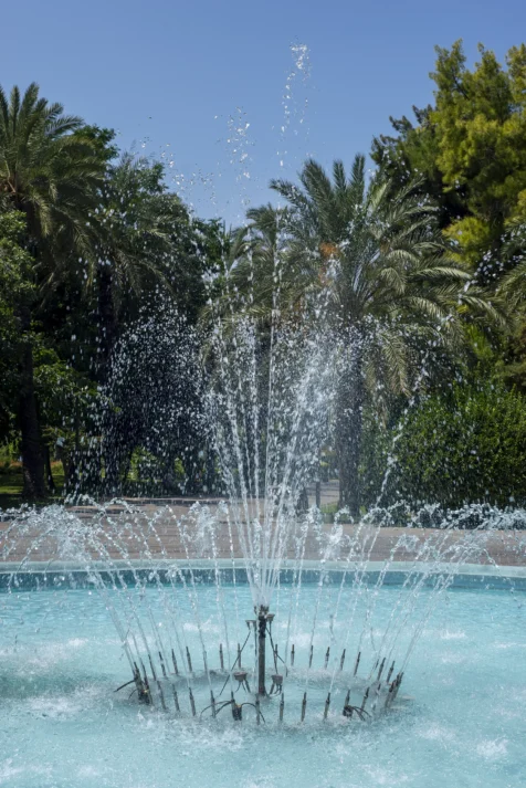 A fountain and palm trees at a park in Antalya, Turkey, 2023.