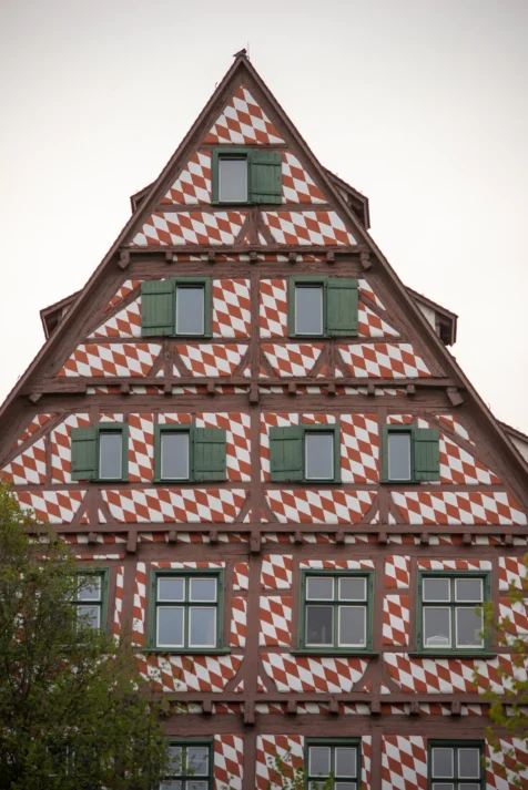 A funky red and white building in Ulm, Germany, 2023.