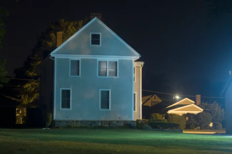 A house illuminated by streetlights at night in Jamestown, Rhode Island, 2014.