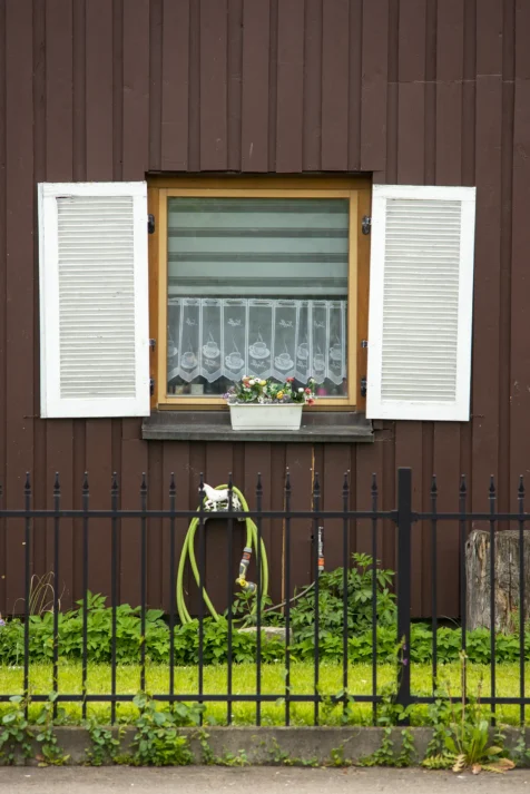 A contrasting house exterior and fence in Neu-Ulm, Germany, 2023.