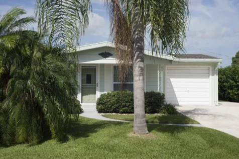 A light green house on a sunny day in Port Saint Lucie, Florida, 2016.