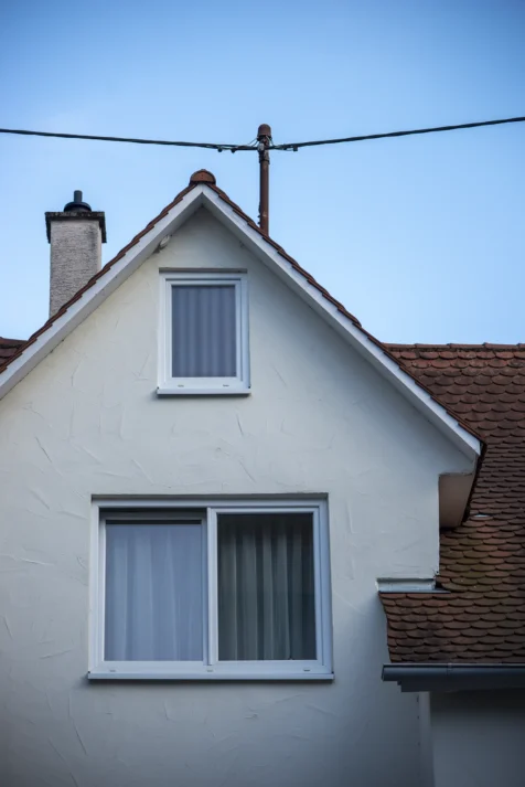 A house and power line at dusk in Geislingen an der Steige, Germany, 2023.