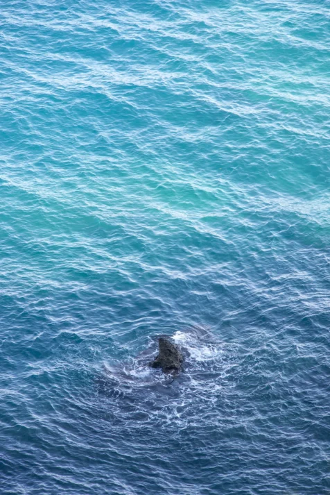 A large rock in the Mediterranean Sea near the Duden Waterfalls in Antalya, Turkey, 2023.