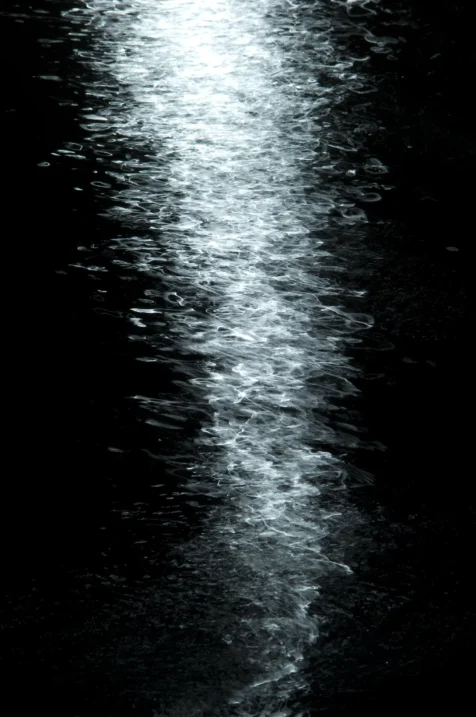 Light dances on the Hudson River at night in Nyack, New York, 2015.